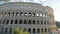 Wide angle panning shot of the colosseum, rome