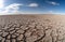 Wide angle panorama of dried lake bed, draught concept landscape, generative AI illustration