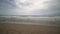 Wide angle panoramic of the sea surf. Cloudy morning of sandy Mediterranean Beach. Mediterranean coast