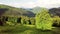 Wide-angle panoramic shot of beautiful meadows, hills and trees in Synevyrska glade next to Synevyr lake. Majestic and