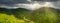 Wide-angle panoramic shot of beautiful meadows, hills and trees in Synevyrska glade next to Synevyr lake. Majestic and