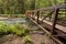 Wide angle photo of Metal Nature Bridge end near Marymere Falls, Olympic National Park