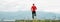 Wide angle shoot of a Man dressed in red long sleeve shirt runs