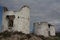 A wide angle shot from the base of an abandoned windmill