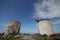 A wide angle shot from the base of an abandoned windmill