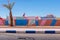 Wide angle shot colorful buildings and palm tree in the town of Tagonite in Draa Valley, Morocco