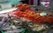 Wide angle shot of fish, crabs and other types of seafood on the market