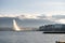 Wide angle shot of a fountain in front of the buildings in Geneva, Switzerland