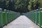 Wide angle shot of the green fence of the Public Park in Thailand