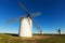 Wide angle shot of group of windmills in sunny day