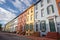 wide-angle shot of italianate row houses with notable deep eaves