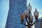 Wide angle shot of a lamp in front of a skyscraper