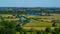 Wide angle shot of a large landscape full of trees and water in Wittenham Clumps, UK