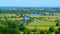 Wide angle shot of a large landscape in Wittenham Clumps, UK full of trees and water