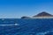 Wide angle shot of people windsurfing in front of the mountains in Spain