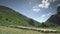 Wide angle shot of sheep in mountain pastures