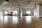wide-angle shot of spacious, minimalist yoga studio