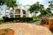 Wide angle shot of Spanish holiday apartment building in beautiful landscaped gardens