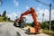 Wide angle threatening view of an excavator