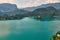 Wide angle view of Bled lake with mountains, island and pilgrimage church, view from the Bled Castle upper yard