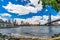 Wide angle view Brooklyn Bridge, Manhattan Bridge with lower Manhattan skyline, One World Trade Center Empire Fulton