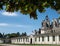 Wide angle view of Chateau Chambord entrance with french flag.