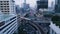 Wide angle view of elevated monorail train, passing between skyscrapers in Shimbashi Financial district. View from the