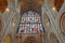 Wide-Angle view of the entrance inside the Cathedral with stained glass, columns and the vaulted roof