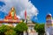 Wide angle view of Holy statue of Guru Padmasambhava or born from a lotus, Guru Rinpoche, Blue sky and white clouds, Samdruptse,