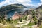 Wide angle view of the Kotor Gulf or Boka Kotorska with medieval town  sea port with ferryboats and surrounding mountains.