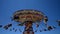 Wide angle view of large luna park spinning swing carousel