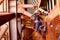 Wide angle view picture of male rope access welder worker wearing full safety harness, helmet working hanging on tie line setting