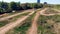 Wide angle view of a race track with a racer driving through it on his motorcycle