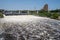 Wide angle view of St. Anthony Falls in downtown Minneapolis, Central Avenue Bridge in background. Fast currents create foamy