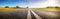 Wide asphalt road panorama in countryside on summer day.