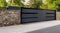 Wide automatic sliding gate with remote control. Security and protection concept