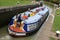 Wide beam narrowboat leaving lock