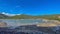 Wide beautiful photography of mountain, cloudscape, fishing boats on lake and sky