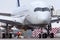 Wide-body aircraft at the airport parking lot, view of the cockpit and landing gear