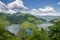 Wide calm river running through green forested hills in southern Bulgaria