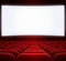 Wide cinema screen and red seats