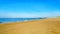 The wide and clean sandy beach at Banjaardstrand along the Oosterschelde with the Delta Works Storm Barrier in the bacground