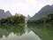 Wide clear green river and high mountains