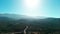 Wide Drone flying around park on green hill in California state Daytime landscape.