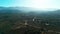 Wide Drone shot of flying around park on green hill in California state Daytime landscape.