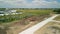 Wide Drone shot of suburb in pre construction empty lots and home