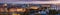 Wide, elevated panorama of the lit skyline of Prague, Czech Republic