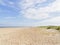 A wide empty beach under a summer sky at Caister-on-Sea, Norfolk