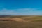 Wide empty fields view from the The Belle Tout lighthouse on top of Seven Sisters, Clifftop Paths Nature Reserve. South of England