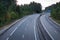 Wide empty highway with curve in the morning. Travel and destination background. Free asphalt road background.